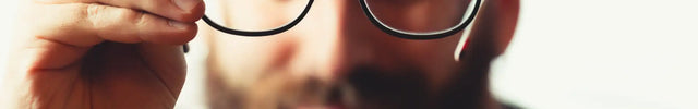 Black-framed eyeglasses with round lenses.